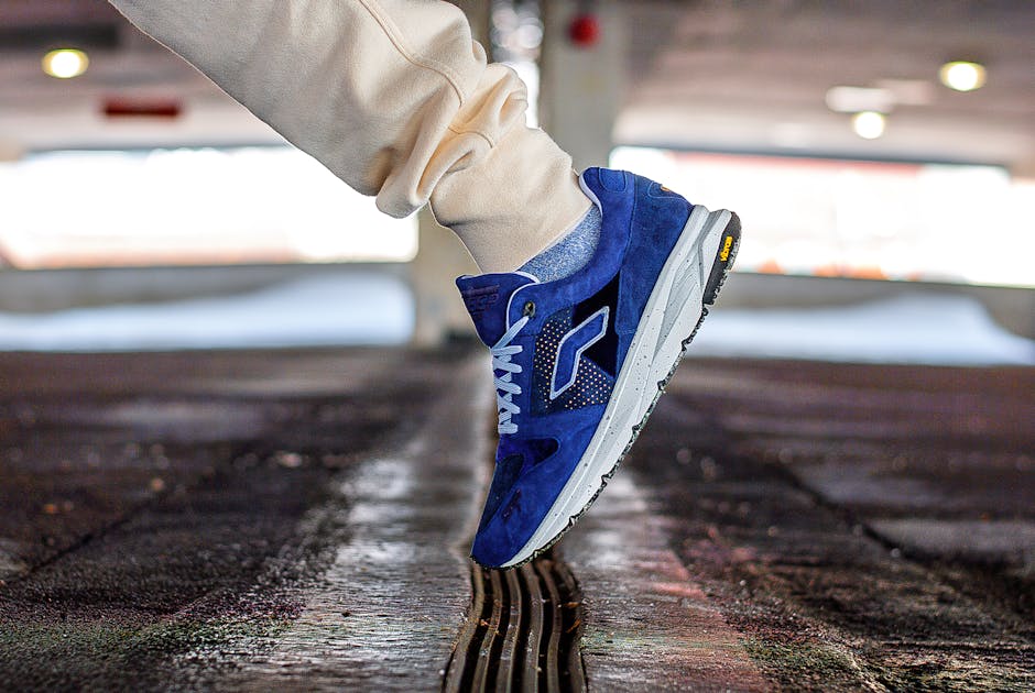 Dynamic shot of a blue sneaker in action, perfect for fashion and sports themes.