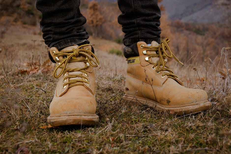 Sturdy hiking boots on rugged mountain terrain, perfect for outdoor adventures.