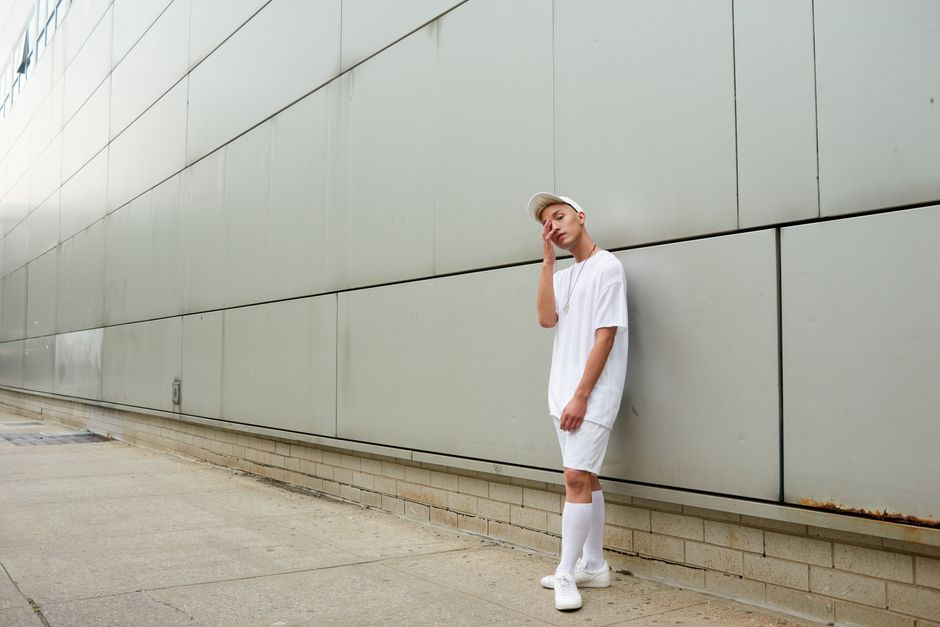Contemporary minimalist streetwear fashion shot in urban New York setting.